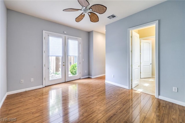 5162 Estasi St, Las Vegas, NV 89135 - spare room with a ceiling fan, wood finished floors, french doors, and baseboards