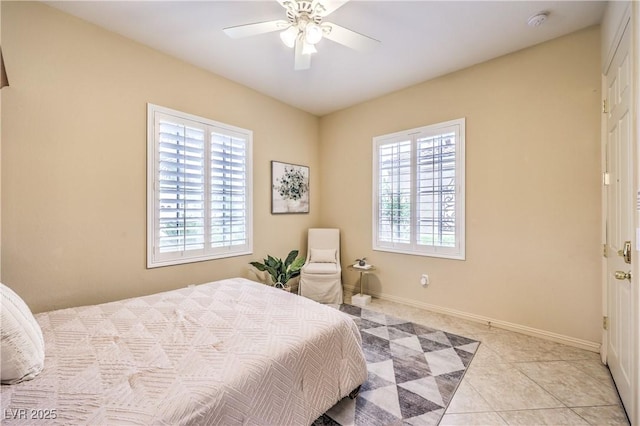 5162 Estasi St, Las Vegas, NV 89135 - bedroom with multiple windows, light tile patterned floors, a ceiling fan, and baseboards