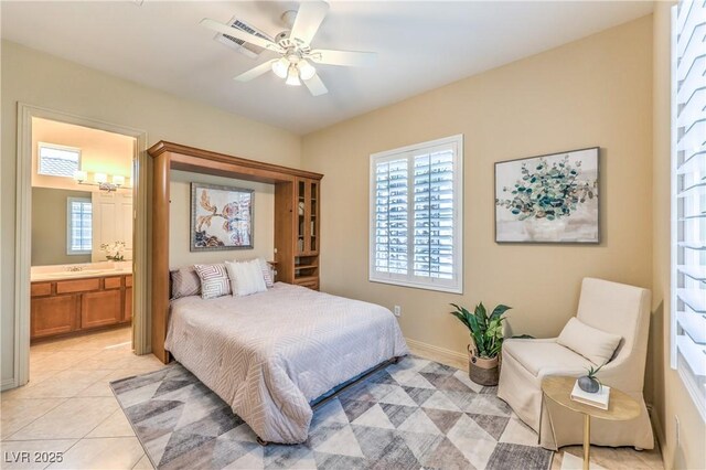 5162 Estasi St, Las Vegas, NV 89135 - bedroom featuring a chandelier, connected bathroom, a ceiling fan, a sink, and light tile patterned flooring