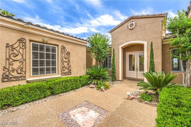 5162 Estasi St, Las Vegas, NV 89135 - doorway to property featuring french doors and stucco siding