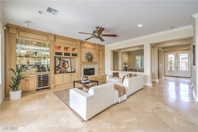 5162 Estasi St, Las Vegas, NV 89135 - living room with beverage cooler, bar area, ornamental molding, french doors, and a ceiling fan
