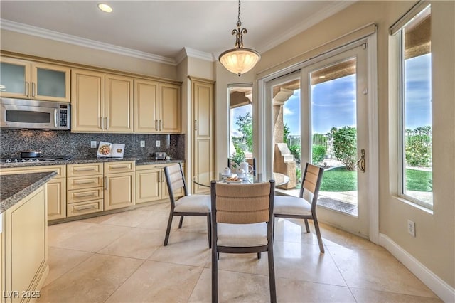 5162 Estasi St, Las Vegas, NV 89135 - dining room with light tile patterned floors, crown molding, and baseboards