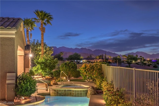 5162 Estasi St, Las Vegas, NV 89135 - view of pool with an in-ground hot tub, a mountain view, and a fenced backyard