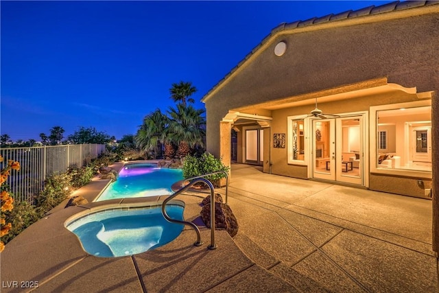 5162 Estasi St, Las Vegas, NV 89135 - pool at twilight featuring an in-ground hot tub, a patio, and a fenced backyard