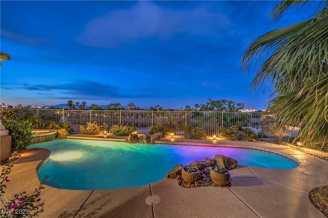 5162 Estasi St, Las Vegas, NV 89135 - pool at dusk with a fenced backyard and a patio