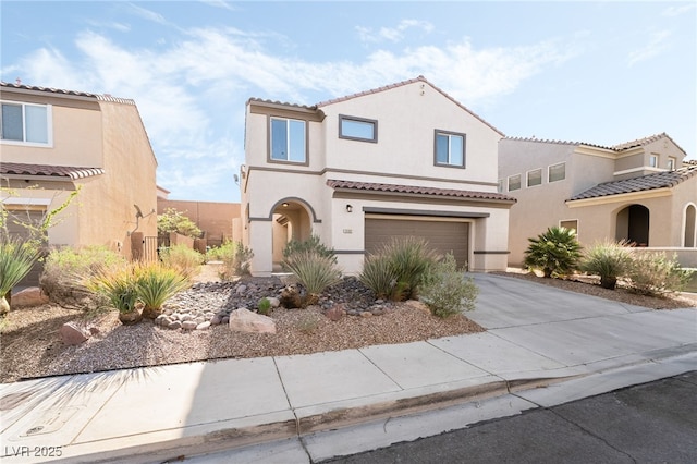 2482 Denholme St, Henderson, NV 89044 - mediterranean / spanish home featuring stucco siding, driveway, a garage, and a tiled roof