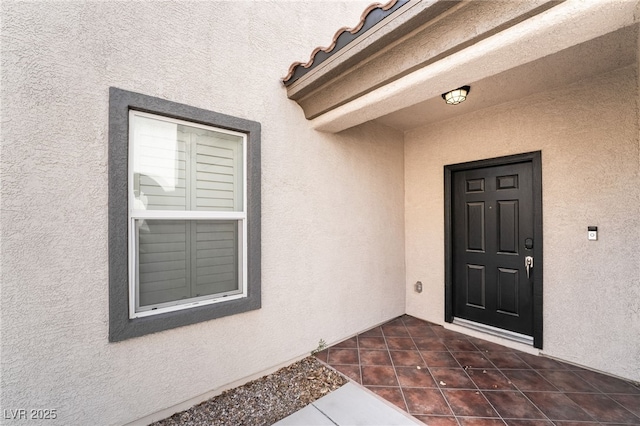 2482 Denholme St, Henderson, NV 89044 - doorway to property with stucco siding