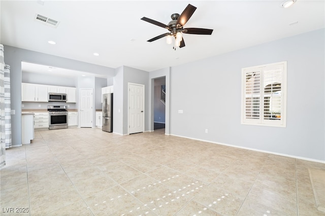 2482 Denholme St, Henderson, NV 89044 - unfurnished living room featuring ceiling fan, light tile patterned flooring, recessed lighting, and baseboards