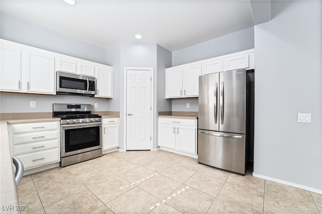 2482 Denholme St, Henderson, NV 89044 - kitchen featuring appliances with stainless steel finishes, light countertops, white cabinetry, light tile patterned floors, and recessed lighting