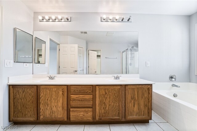 2482 Denholme St, Henderson, NV 89044 - bathroom featuring a shower stall, double vanity, a garden tub, and tile patterned flooring