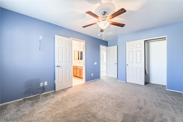 2482 Denholme St, Henderson, NV 89044 - unfurnished bedroom featuring light colored carpet, a closet, baseboards, and a ceiling fan