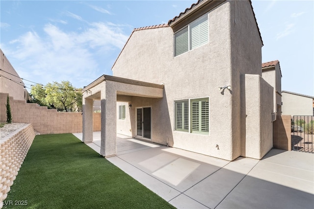 2482 Denholme St, Henderson, NV 89044 - rear view of property with stucco siding, a tiled roof, and a patio area