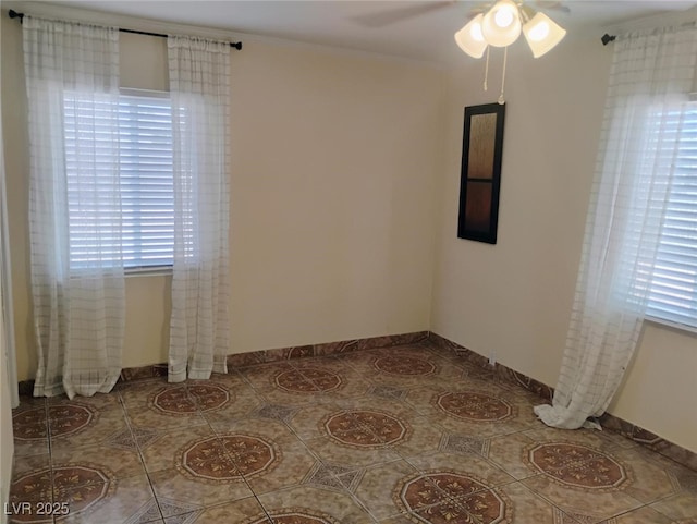 4525 Fulton Pl, Las Vegas, NV 89107 - unfurnished room with a ceiling fan, tile patterned flooring, healthy amount of natural light, baseboards, and crown molding