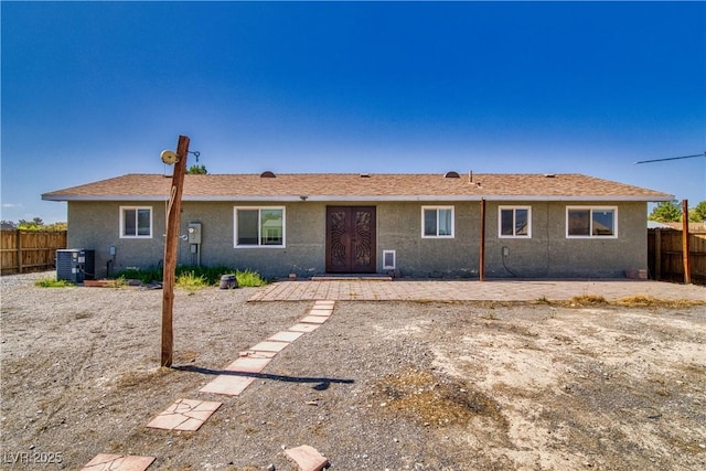 1190 W Sierra Vista Cir, Pahrump, NV 89060 - rear view of house with central AC and stucco siding