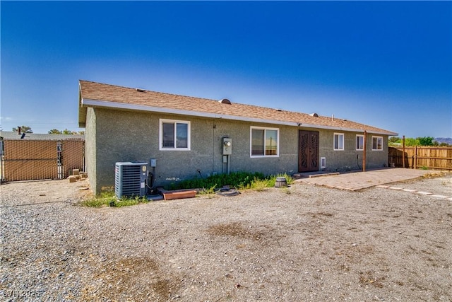 1190 W Sierra Vista Cir, Pahrump, NV 89060 - back of property featuring cooling unit, stucco siding, and a patio