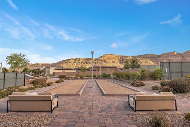 6700 Regency Stone Way, Las Vegas, NV 89148 - view of property's community with a game area and a mountain view