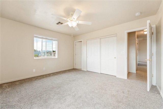 480 China St, Pahrump, NV 89048 - unfurnished bedroom with carpet flooring, a closet, baseboards, and ceiling fan