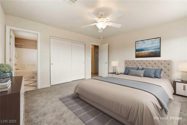 480 China St, Pahrump, NV 89048 - carpeted bedroom with connected bathroom, ceiling fan, and a closet