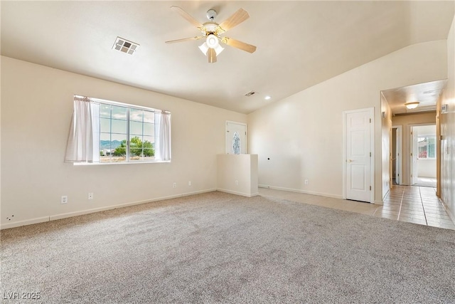 480 China St, Pahrump, NV 89048 - spare room with lofted ceiling, light colored carpet, healthy amount of natural light, a ceiling fan, and baseboards