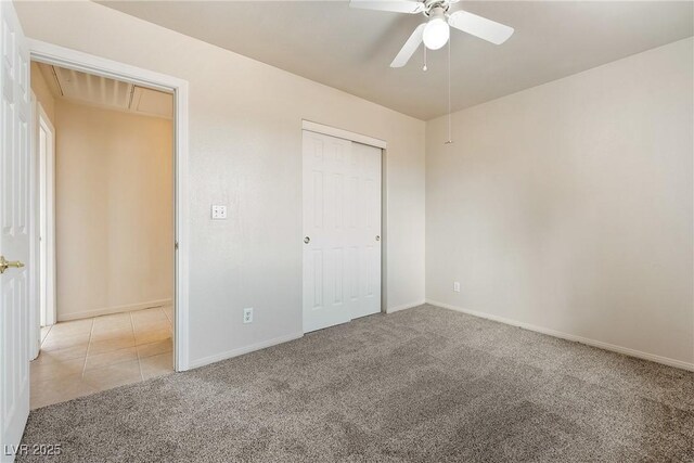 480 China St, Pahrump, NV 89048 - unfurnished bedroom featuring light carpet, baseboards, attic access, a closet, and ceiling fan