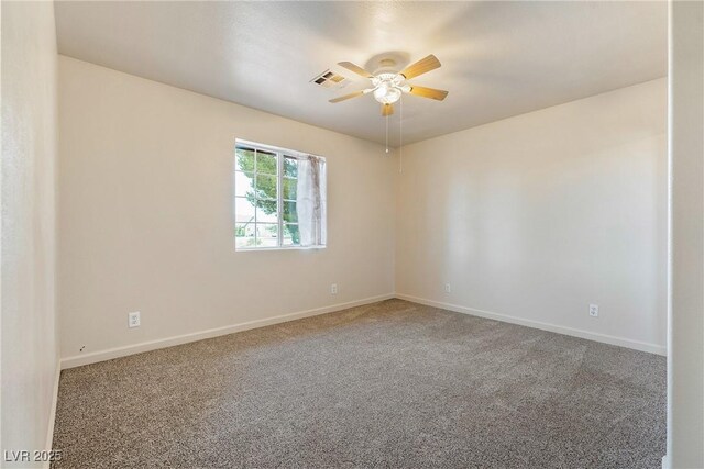480 China St, Pahrump, NV 89048 - spare room with carpet floors, a ceiling fan, and baseboards