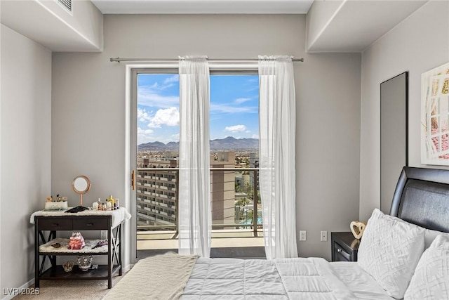 8255 Las Vegas Blvd Unit 1219, Las Vegas, NV 89123 - carpeted bedroom featuring access to exterior and a mountain view