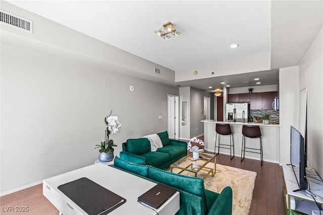 8255 Las Vegas Blvd Unit 1219, Las Vegas, NV 89123 - living room with light wood-type flooring, baseboards, and recessed lighting