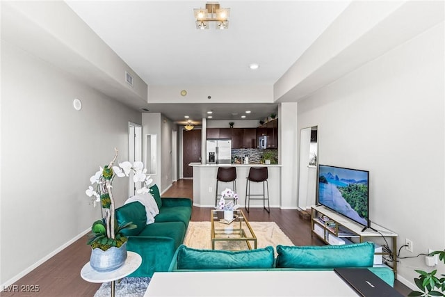 8255 Las Vegas Blvd Unit 1219, Las Vegas, NV 89123 - living area featuring wood finished floors, baseboards, and a chandelier