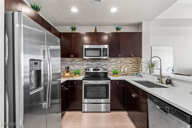 8255 Las Vegas Blvd Unit 1219, Las Vegas, NV 89123 - kitchen with appliances with stainless steel finishes, a sink, light countertops, backsplash, and recessed lighting