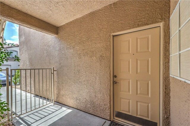 75 N Valle Verde Dr Unit 211, Henderson, NV 89074 - view of exterior entry featuring stucco siding