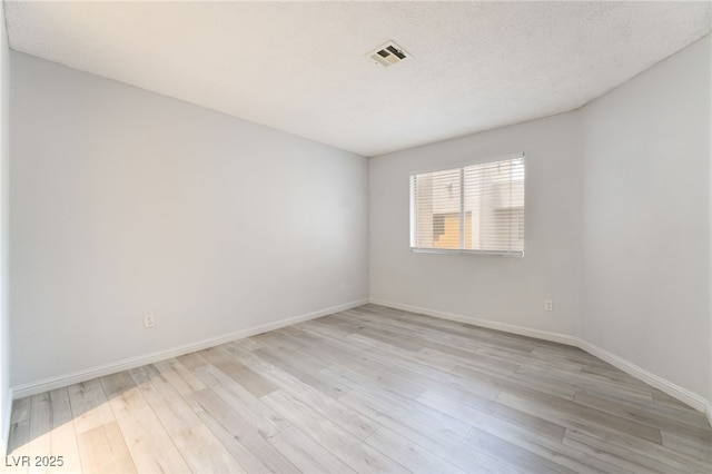 6871 Tamarus St Unit 204, Las Vegas, NV 89119 - empty room with light wood-style floors and baseboards