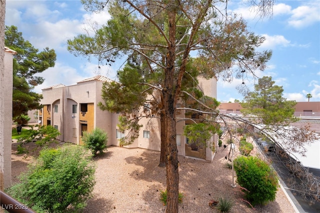 6871 Tamarus St Unit 204, Las Vegas, NV 89119 - view of side of home with stucco siding