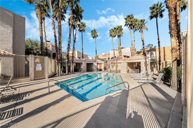 6871 Tamarus St Unit 204, Las Vegas, NV 89119 - community pool with a patio and a residential view