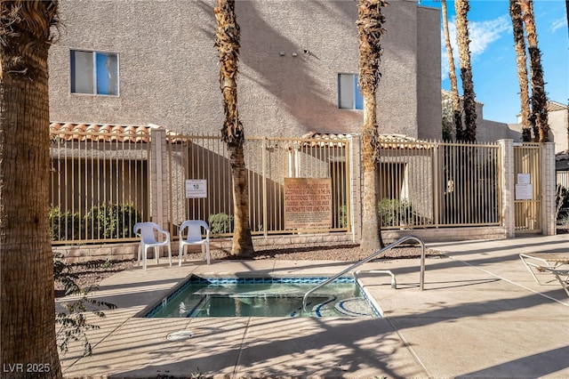 6871 Tamarus St Unit 204, Las Vegas, NV 89119 - view of patio with a hot tub