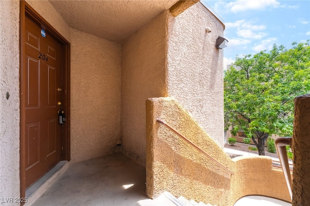 6871 Tamarus St Unit 204, Las Vegas, NV 89119 - property entrance featuring stucco siding