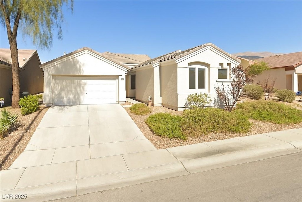3228 Flinthead Dr, North Las Vegas, NV 89084 - single story home with an attached garage, concrete driveway, and stucco siding