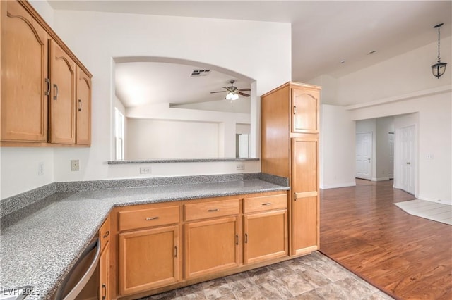 202 Twin Creek St, Henderson, NV 89074 - kitchen featuring lofted ceiling, ceiling fan, dishwasher, arched walkways, and brown cabinetry