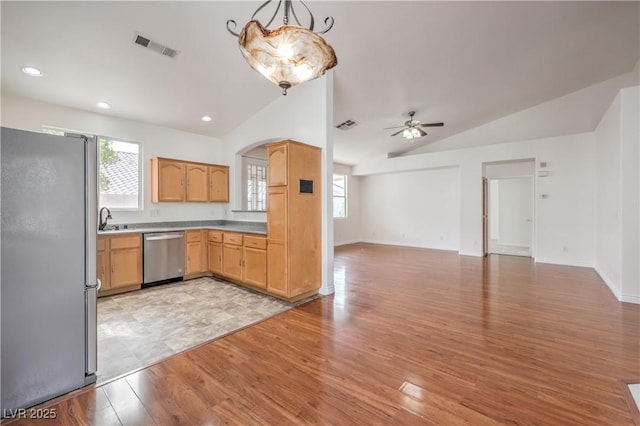 202 Twin Creek St, Henderson, NV 89074 - kitchen featuring stainless steel appliances, lofted ceiling, open floor plan, ceiling fan, and light wood-style flooring