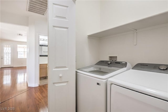 202 Twin Creek St, Henderson, NV 89074 - laundry area featuring independent washer and dryer, wood finished floors, and baseboards