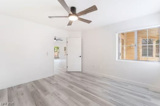 2553 Showcase Dr, Las Vegas, NV 89134 - spare room with a ceiling fan, wood finished floors, and baseboards