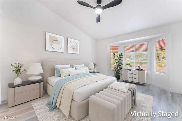 2553 Showcase Dr, Las Vegas, NV 89134 - bedroom featuring vaulted ceiling, light wood-type flooring, ceiling fan, and baseboards