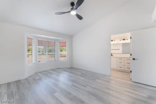 2553 Showcase Dr, Las Vegas, NV 89134 - empty room with vaulted ceiling, ceiling fan, and light wood-type flooring