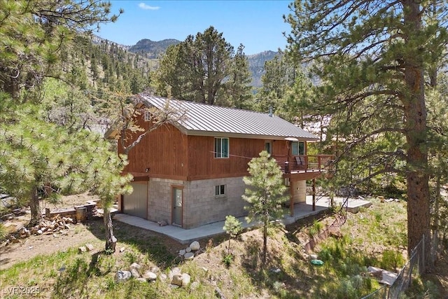 3971 Arlberg Way, Mount Charleston, NV 89124 - view of home's exterior featuring a forest view, metal roof, and a deck with mountain view