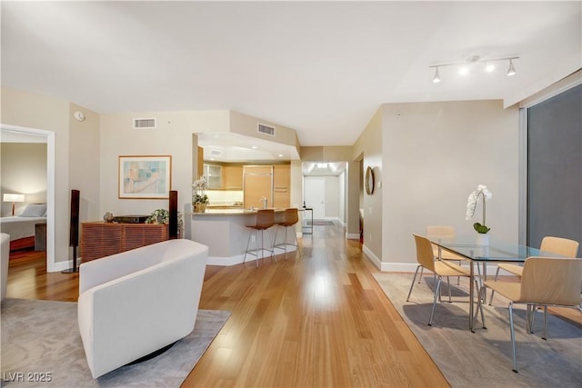 222 Karen Ave Unit 3307, Las Vegas, NV 89109 - living area featuring light wood-type flooring, track lighting, and baseboards