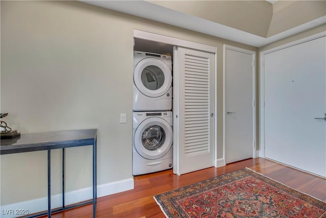 222 Karen Ave Unit 3307, Las Vegas, NV 89109 - laundry area featuring stacked washer / drying machine, wood finished floors, and baseboards