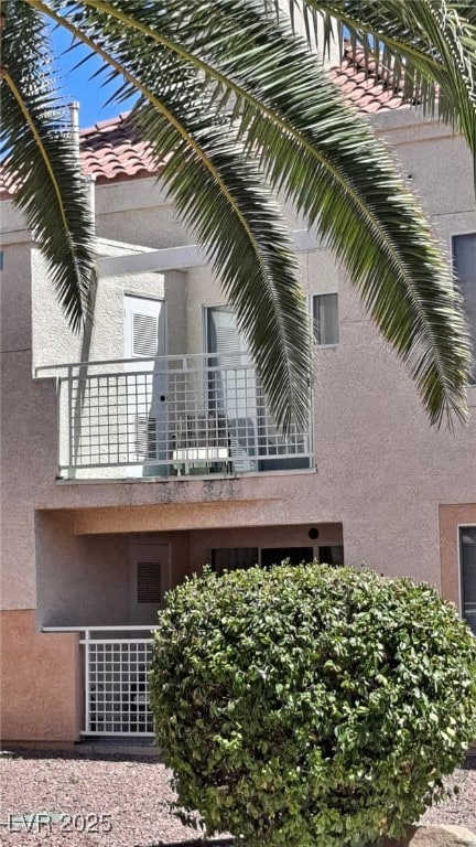 5000 Red Rock St Unit 248, Las Vegas, NV 89118 - view of property exterior with a balcony and stucco siding