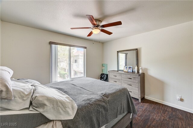 5000 Red Rock St Unit 248, Las Vegas, NV 89118 - bedroom featuring dark wood-type flooring, ceiling fan, and a textured ceiling