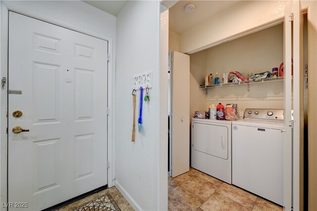 5000 Red Rock St Unit 248, Las Vegas, NV 89118 - washroom featuring washer and clothes dryer and light tile patterned floors