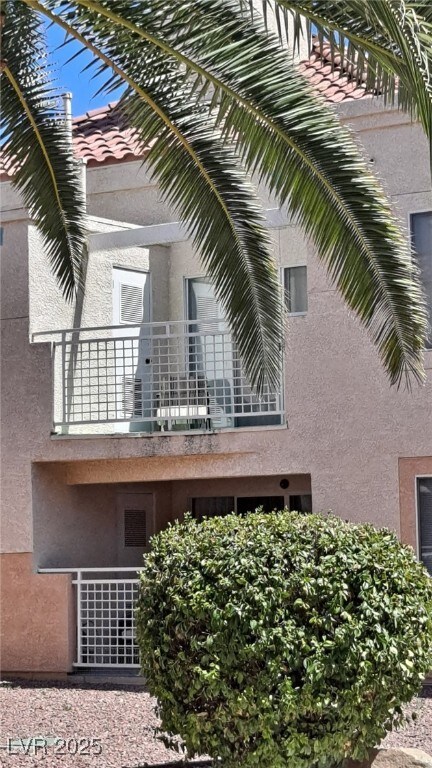 5000 Red Rock St Unit 248, Las Vegas, NV 89118 - view of property exterior featuring a balcony and stucco siding