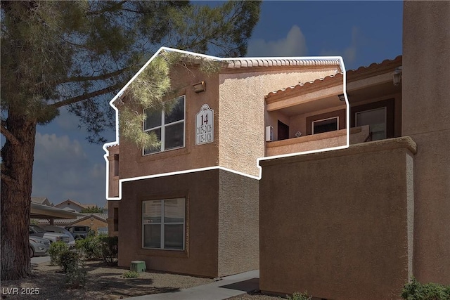 1150 N Buffalo Dr Unit 2025, Las Vegas, NV 89128 - view of side of home featuring stucco siding and a tiled roof